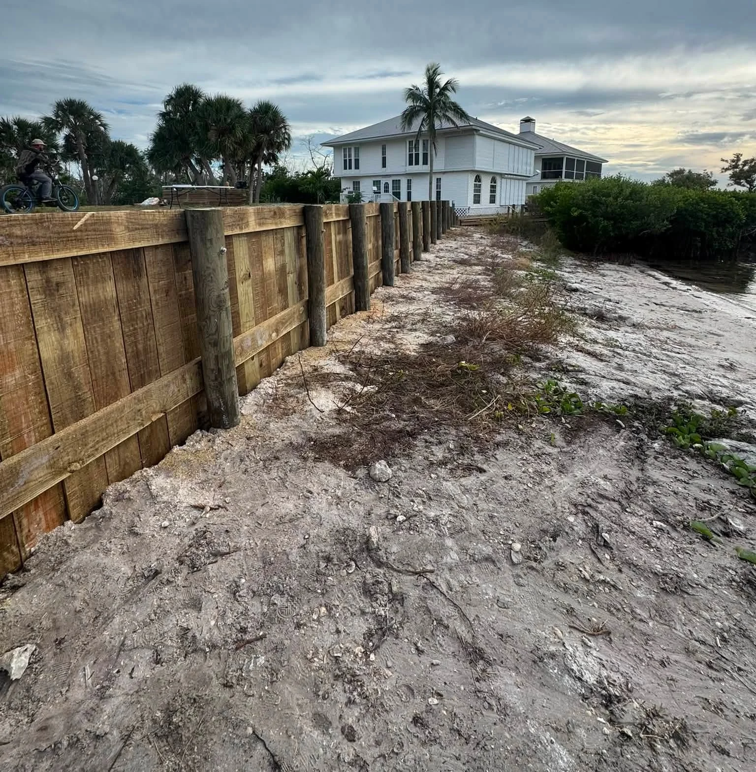 Timber bulkhead with vertical boards and round posts at Useppa Island